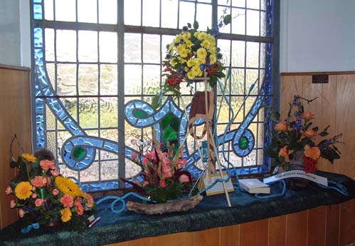 West facing window to the right of the organ